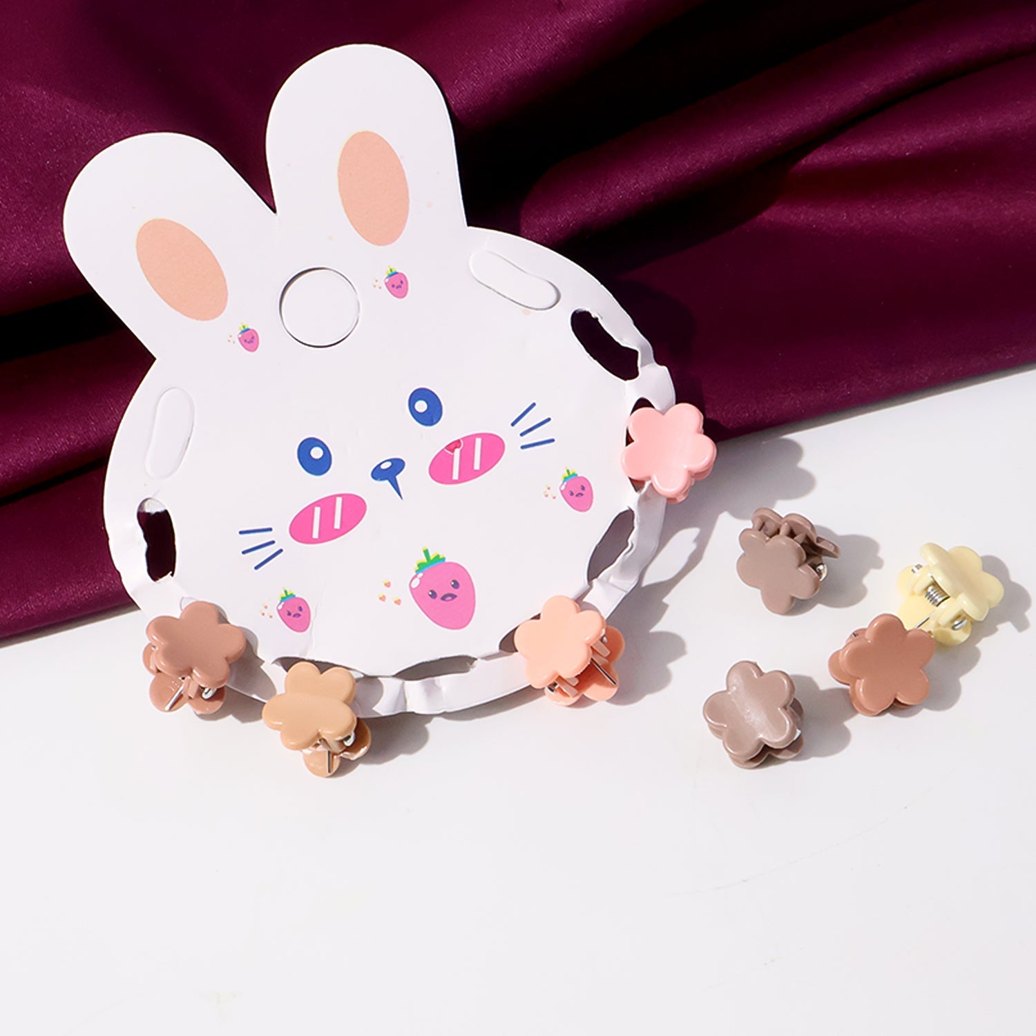 Assorted pastel mini hair claw clips laid out neatly for children's styling