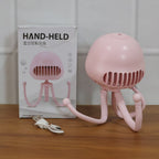 Mini handheld fan with flexible tripod and star projection light in action