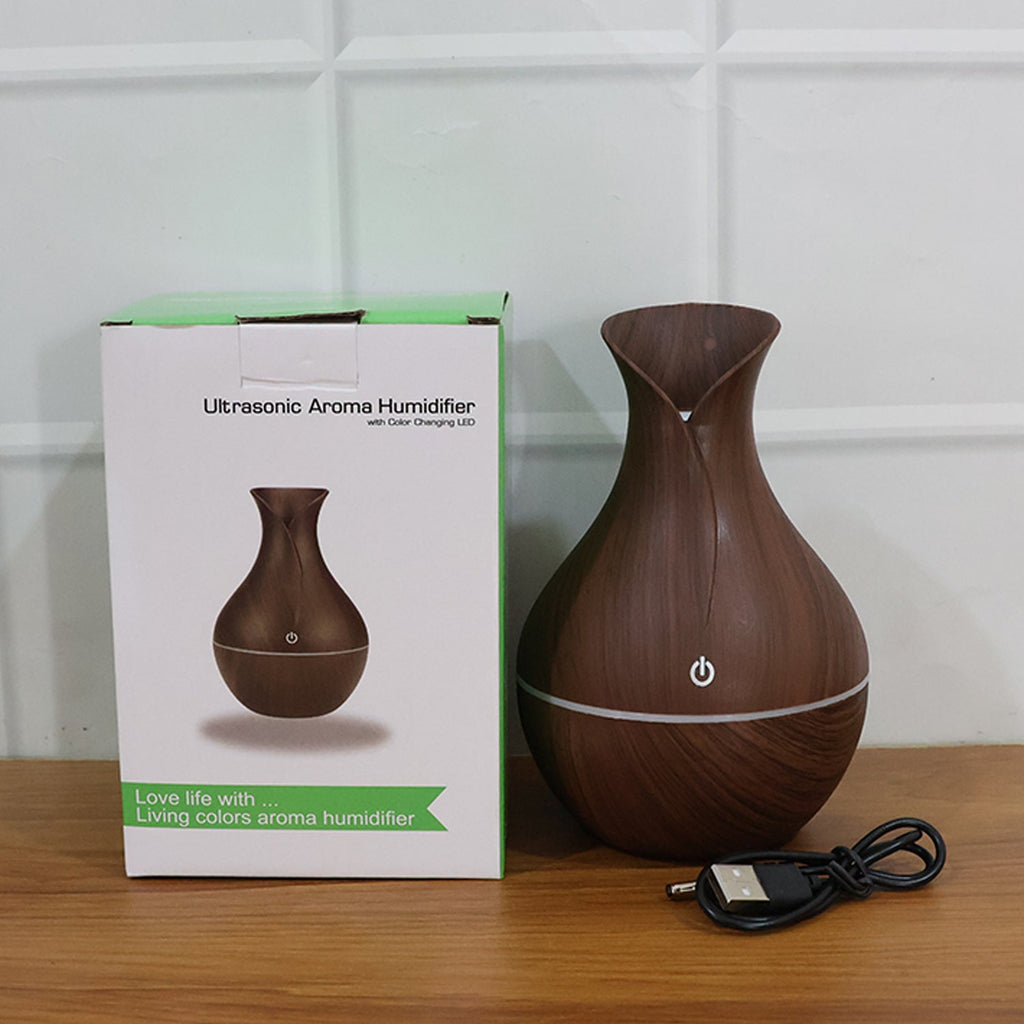 The Mini Wooden Humidifier enhancing a workspace with its quiet operation.