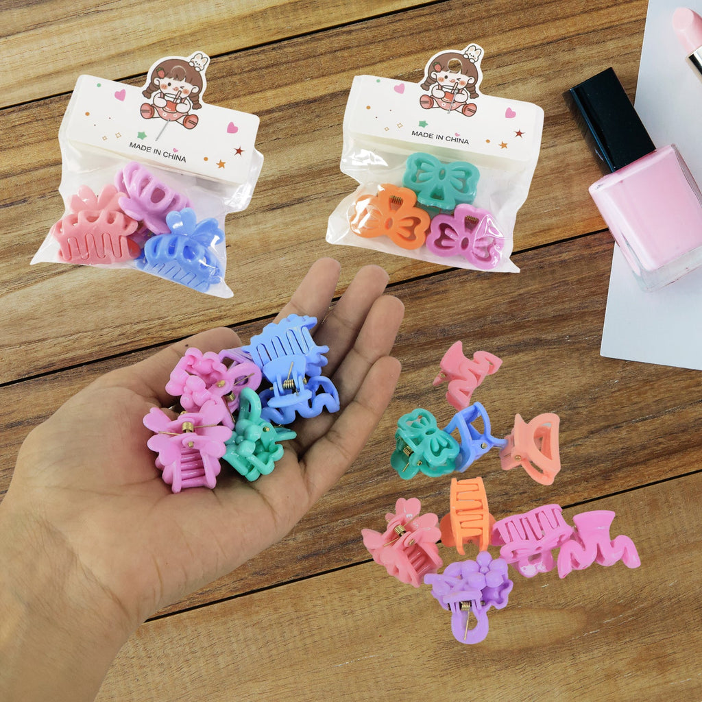 Varied designs of colourful mini hair clips for children, showcasing patterns.