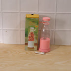 Close-up of portable electric juicer in action