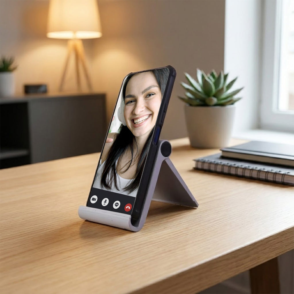 Smartphone securely placed in plastic foldable mobile stand