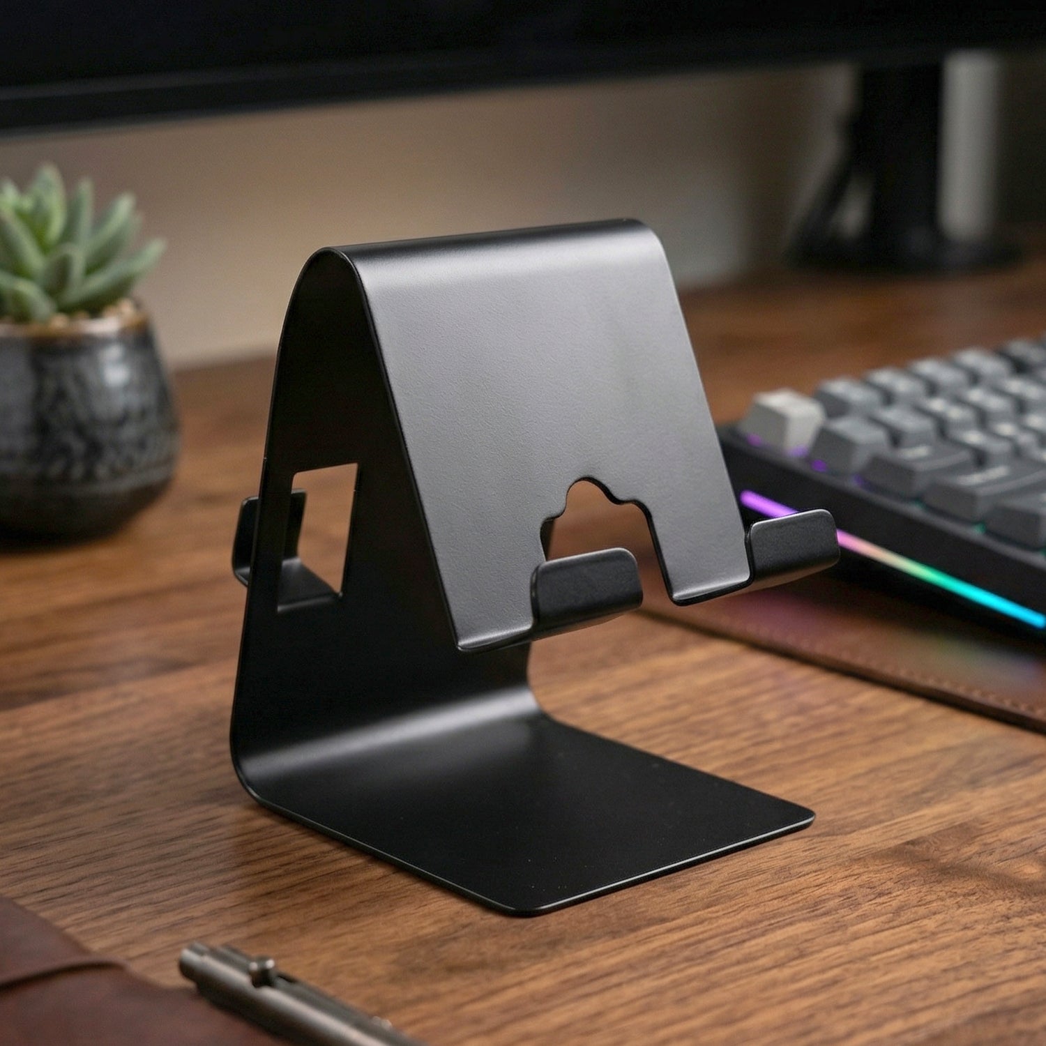 Side view of black foldable metal phone stand