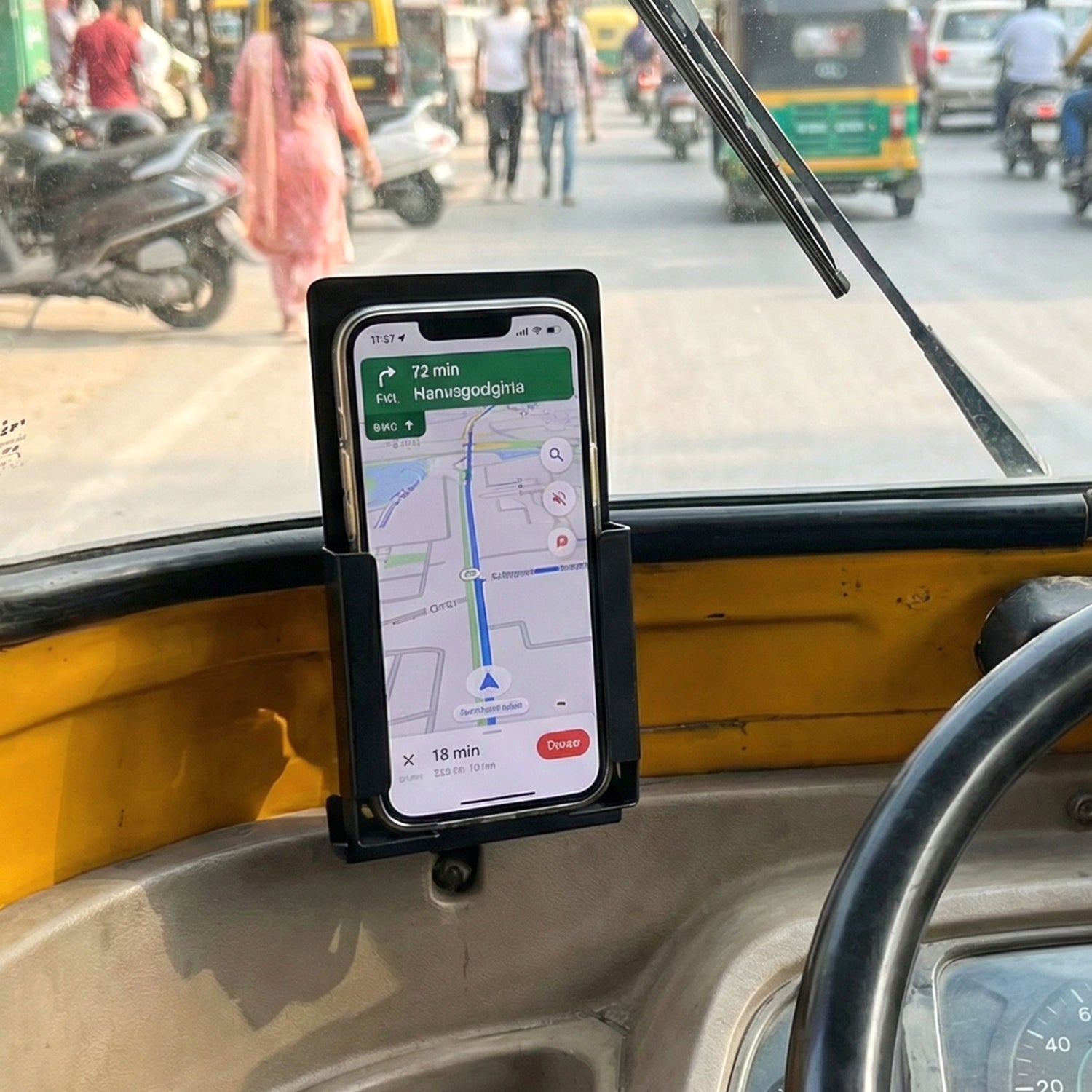 Secure mobile stand mounted on auto rickshaw dashboard