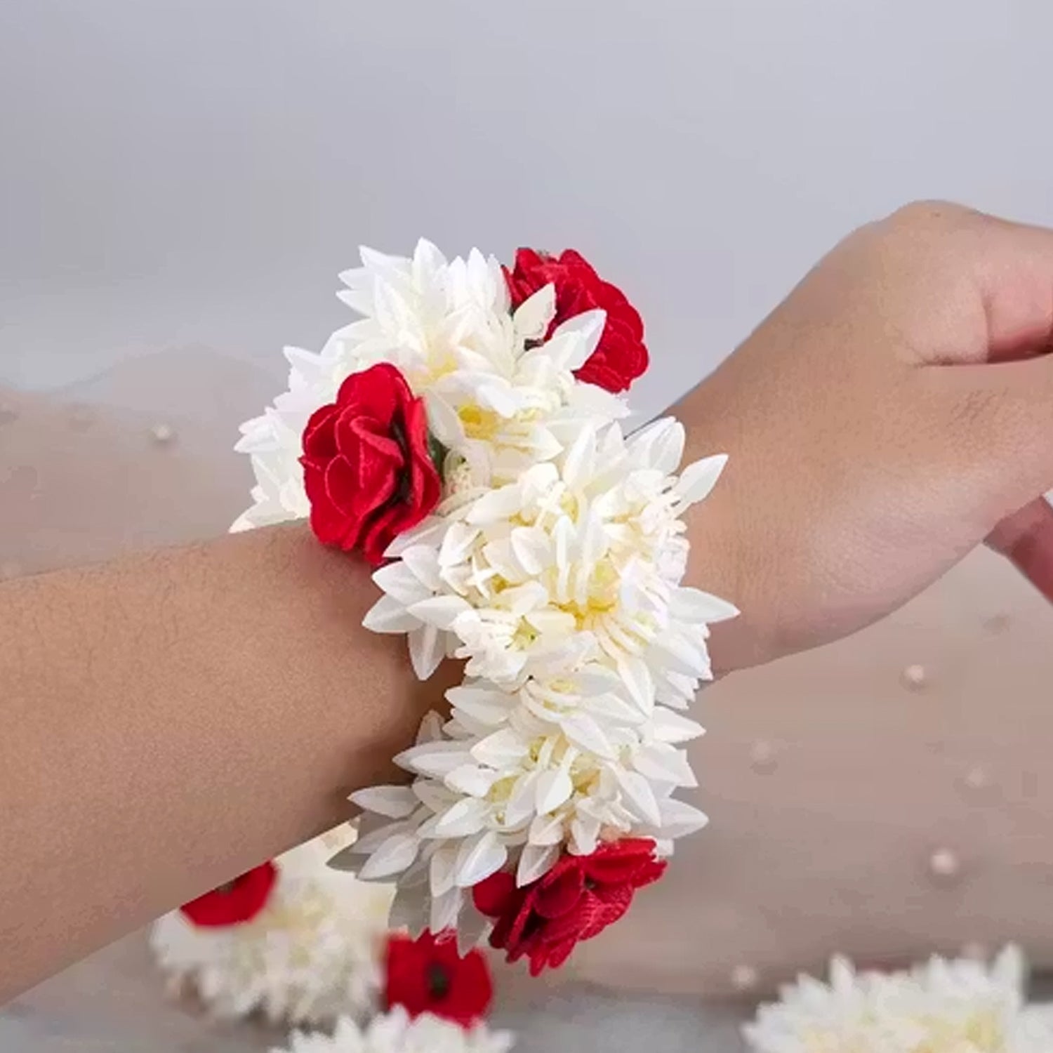 Traditional artificial flower gajra featuring jasmine and red rose floral design