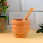 Close-up view of the durable plastic mortar, highlighting its textured interior for better spice grinding.