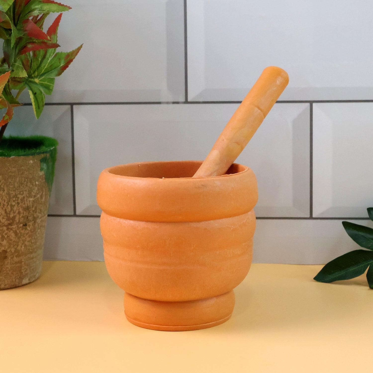 Close-up view of the durable plastic mortar, highlighting its textured interior for better spice grinding.