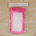 Pink waterproof mobile pouch lifestyle shot in outdoor environment