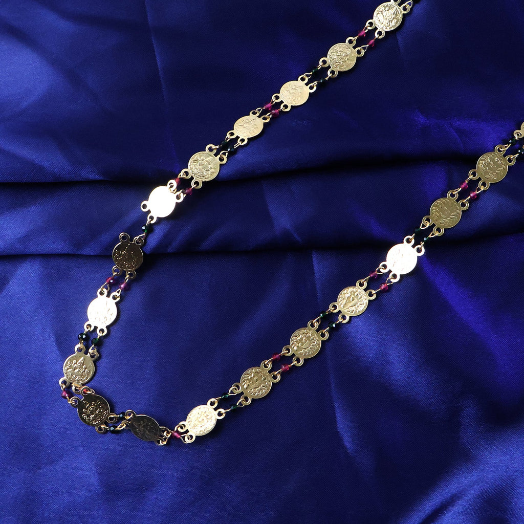Elegant gold accent necklace featuring detailed coin motifs