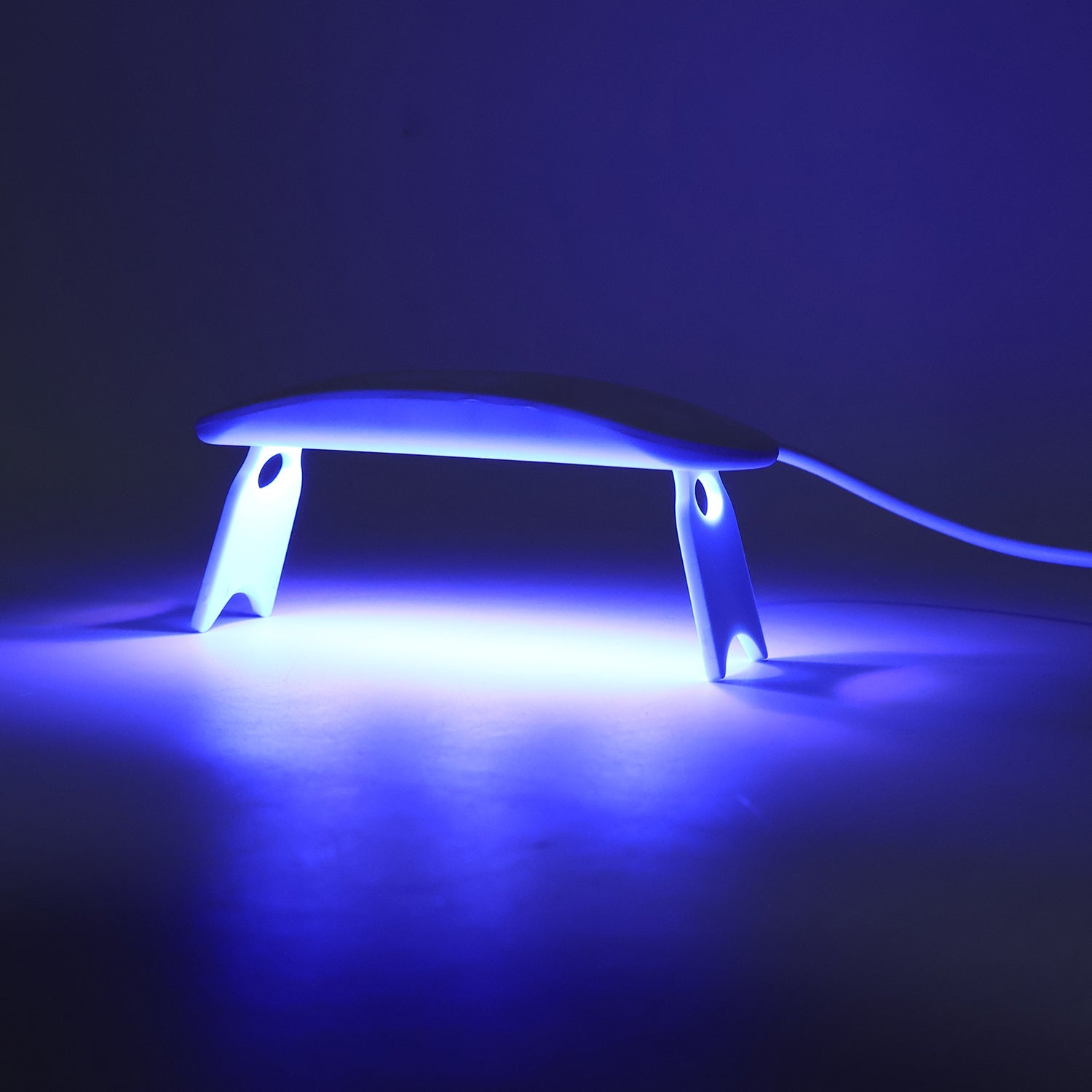 Side view of mini UV LED nail lamp for gel polish cure
