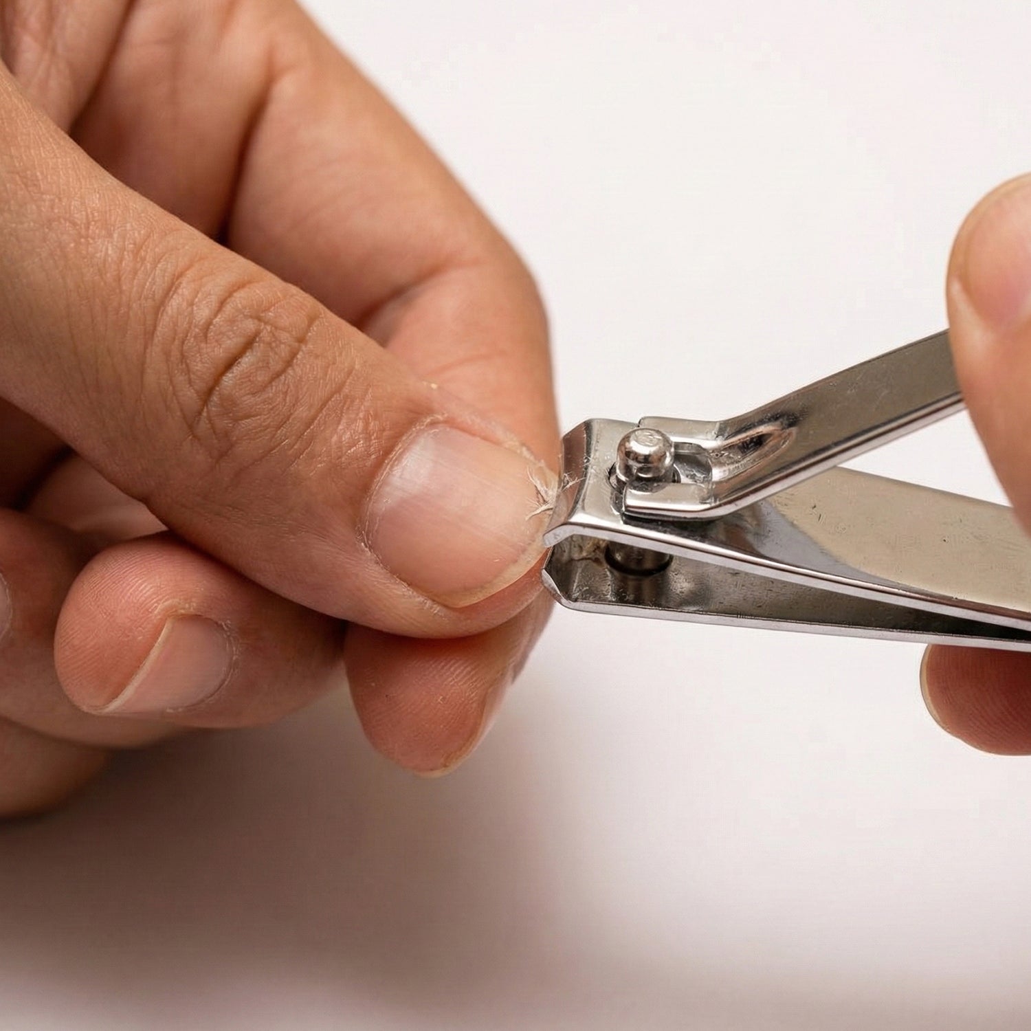 Compact stainless steel nail clipper suitable for travel and home use