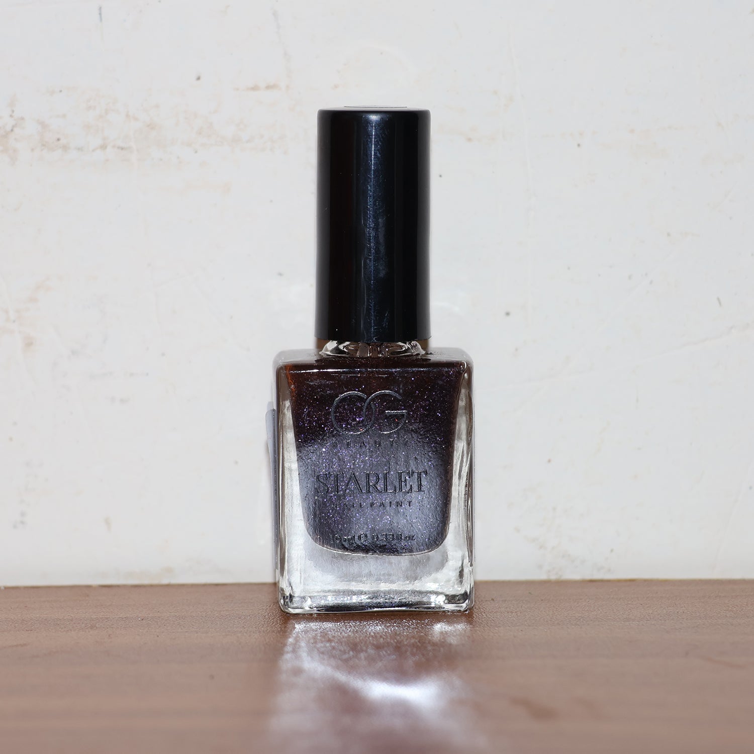 Live image showing Purple Dazzle glitter nail paint for glamorous nails