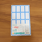 Hand applying writable label sticker to a folder for clear identification