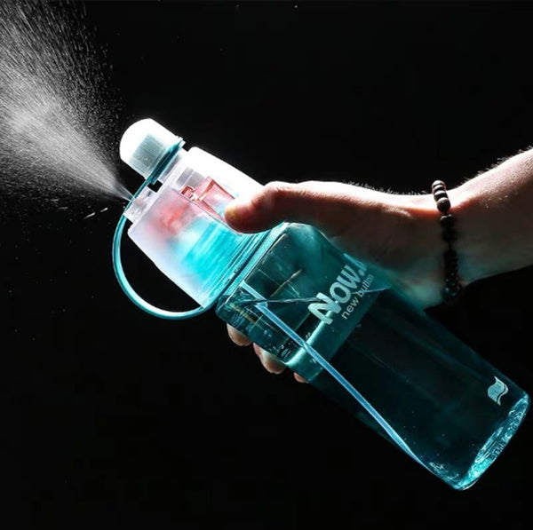 Transparent 600ML spray water bottle showing capacity markings and a secure, leak-proof lid.