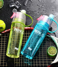 Blue 600ML Spray Water Bottle, ideal for staying hydrated during outdoor activities.