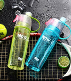Blue 600ML Spray Water Bottle, ideal for staying hydrated during outdoor activities.