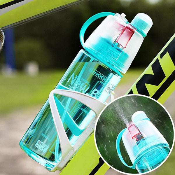 Hand holding the lightweight and portable 600ML spray water bottle.