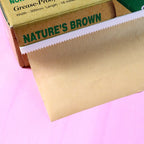 Eco-friendly brown food wrap paper roll in dispenser box