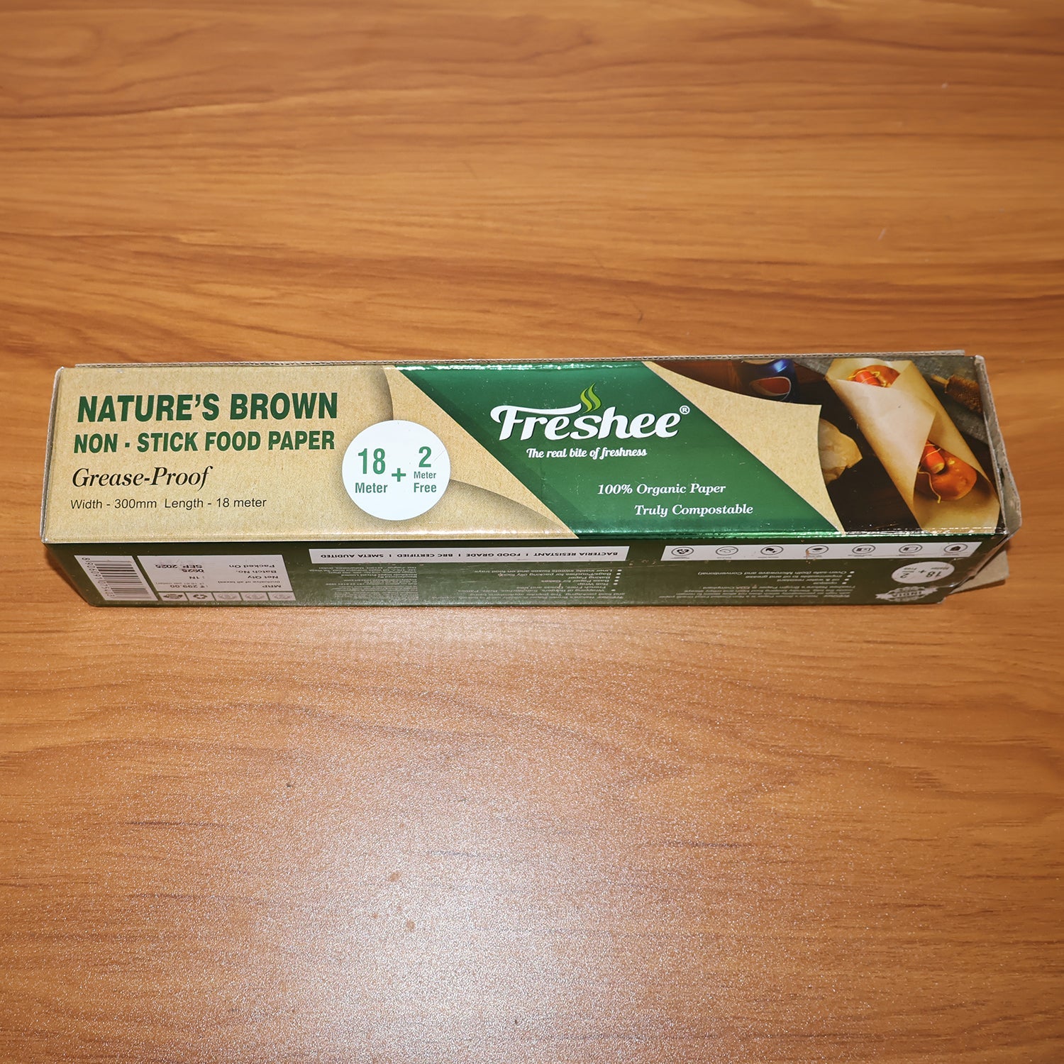 Lifestyle image showing non-stick brown food paper roll in kitchen setting