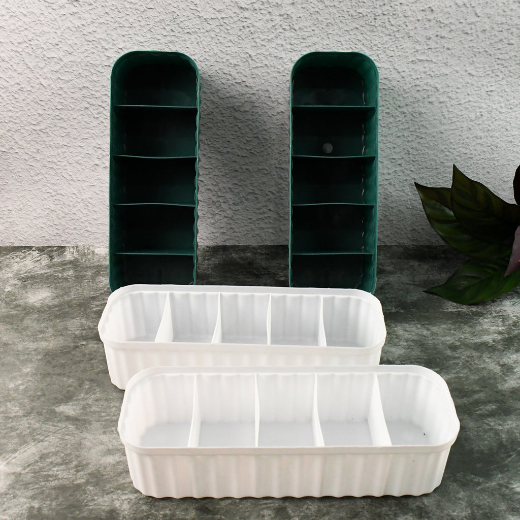 Close-up of a 5-compartment drawer organizer filled with neatly folded socks.