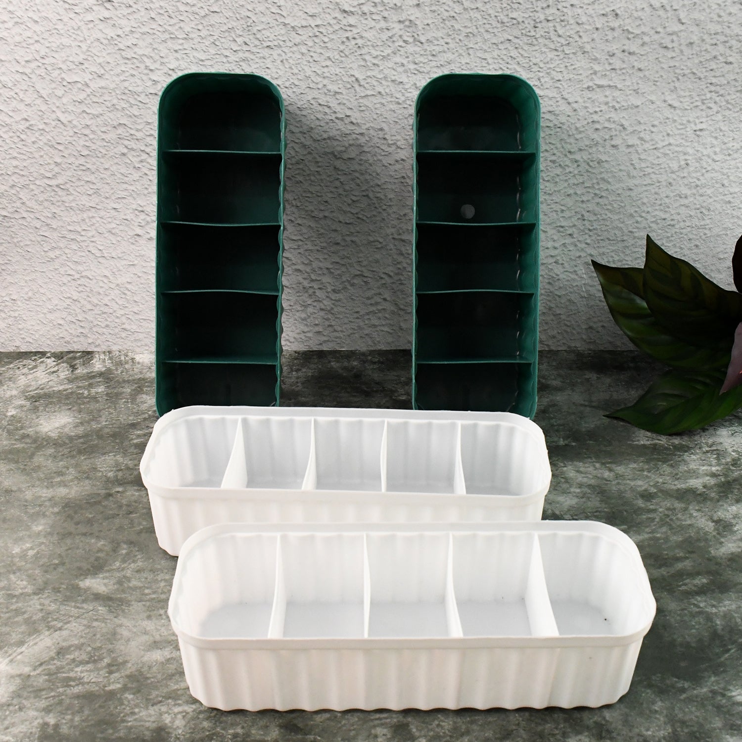Close-up of a 5-compartment drawer organizer filled with neatly folded socks.