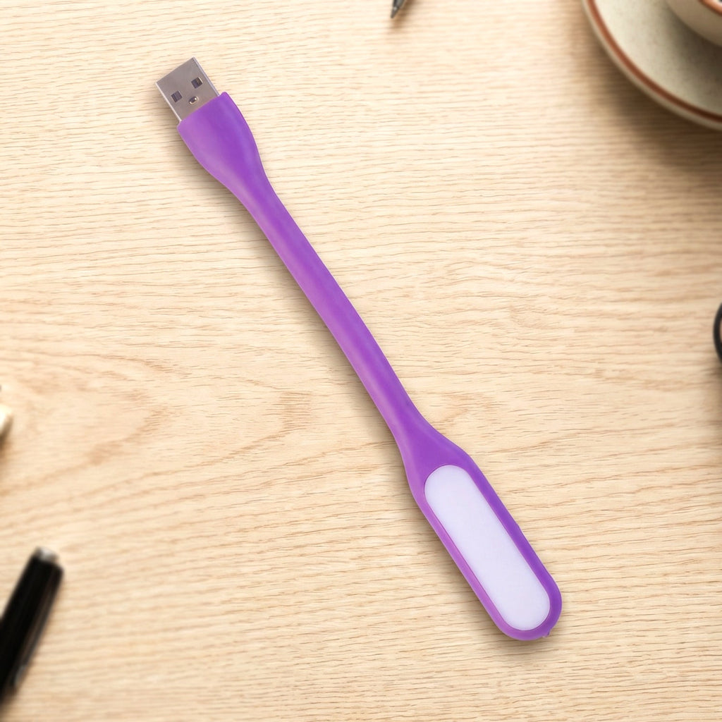 Flexible USB LED Light positioned precisely over a laptop keyboard.