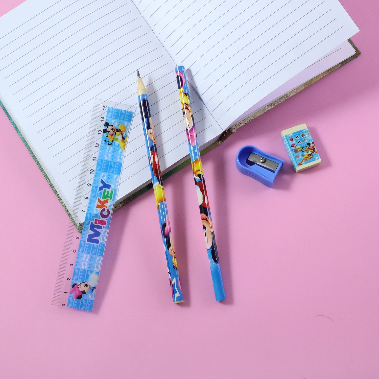 Top view of kids stationery kit items laid out