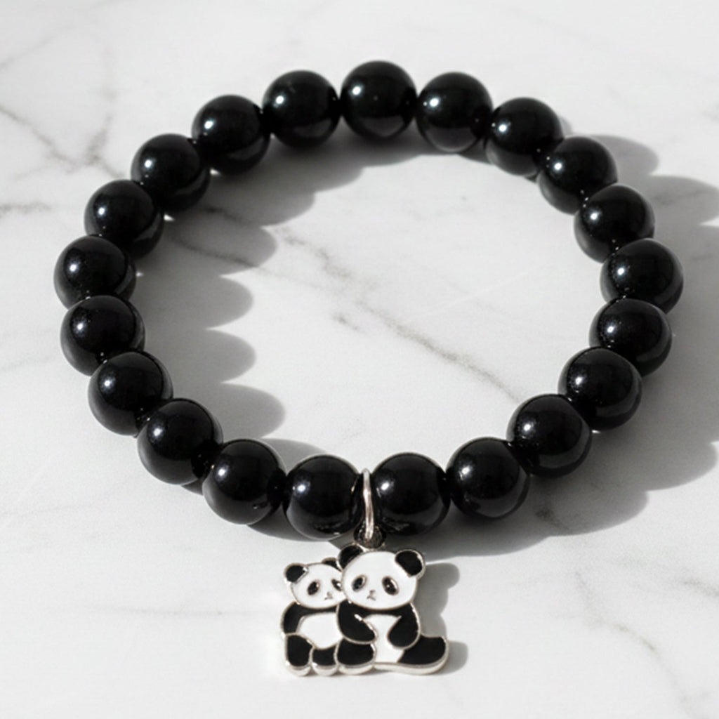 Black beaded stretch bracelet with an adorable panda charm on white background.