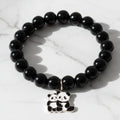Black beaded stretch bracelet with an adorable panda charm on white background.
