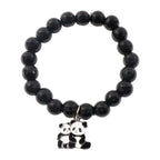 Black beaded stretch bracelet with panda charm shown on a person’s wrist.