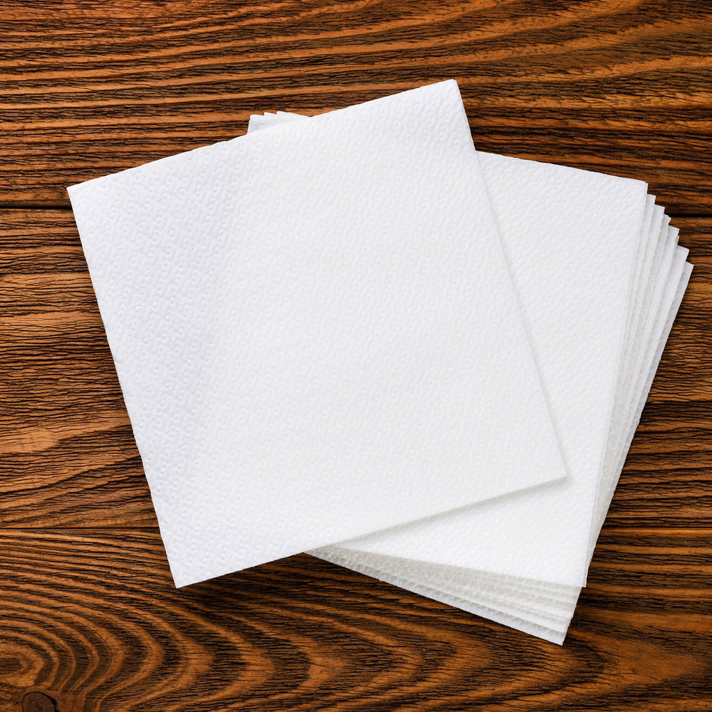 White disposable napkins ideal for restaurant and catering services.