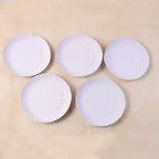 9 inch compostable paper plates arranged for party service