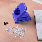 Manual two-hole punch with ergonomic handle for easy paper punching