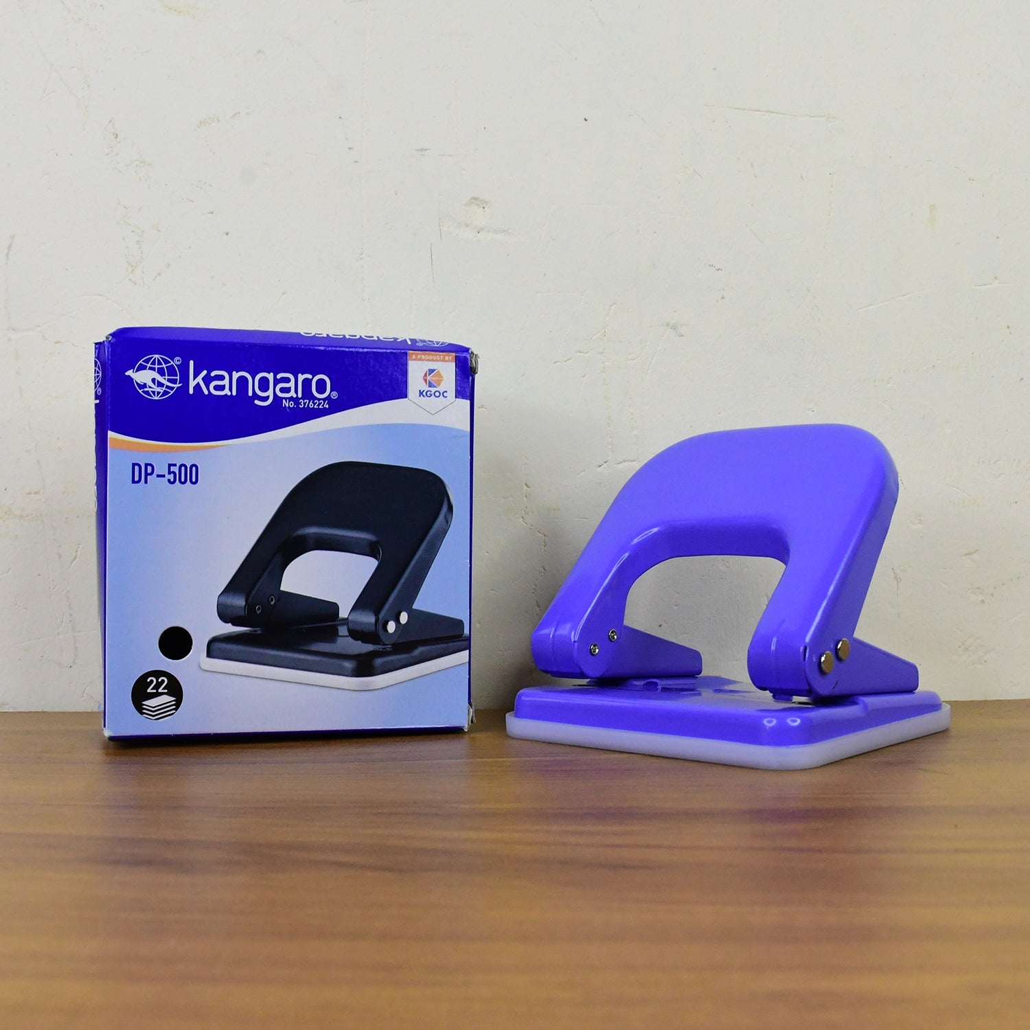 Two-hole punch machine in use demonstrating smooth paper punching