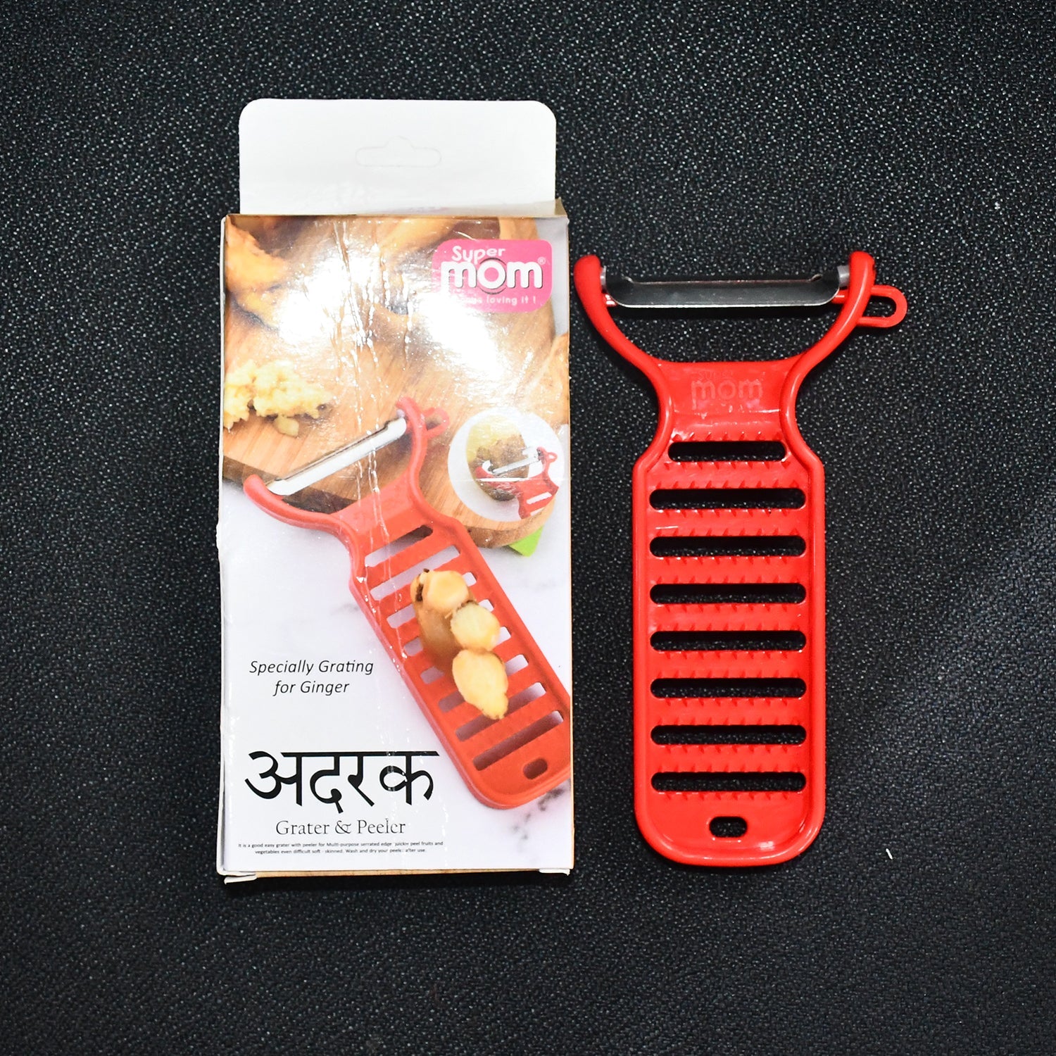 Modern red ginger grater and peeler with ergonomic design