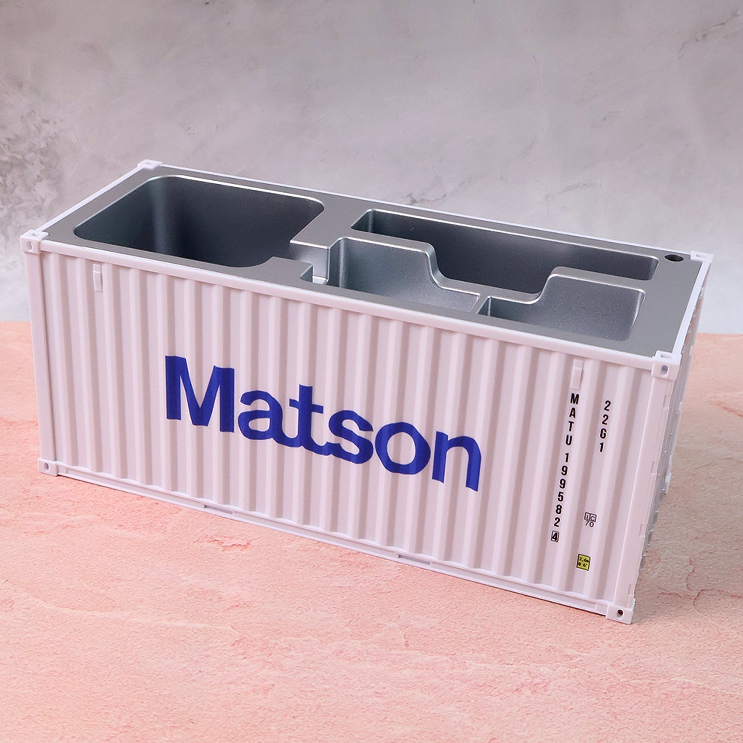 Close-up view of container-style desk storage compartments