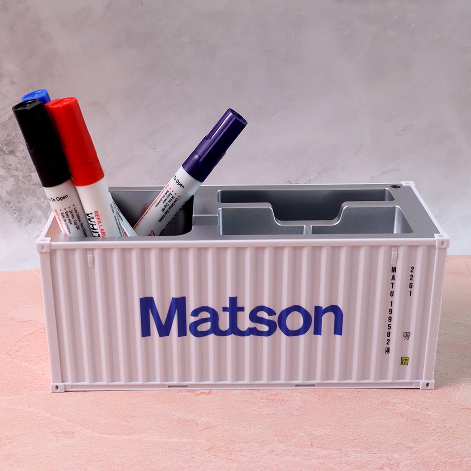 Plastic container box-style desk organizer resembling shipping container