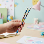 Multiple cartoon-printed graphite pencils arranged neatly showing creative designs
