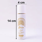 Close-up of Signature Aman fragrance spray bottle with gold accents