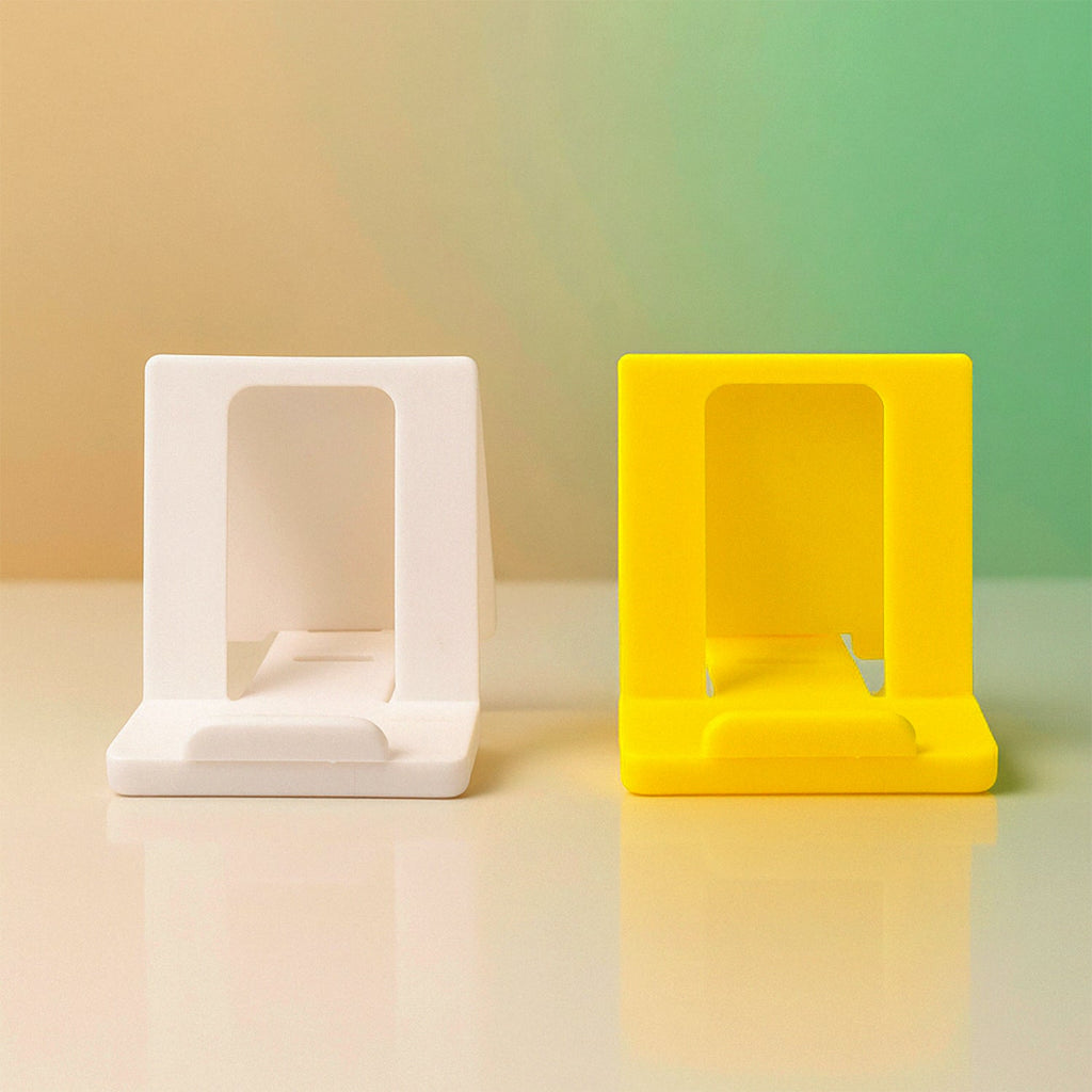Foldable plastic phone stand laid flat for storage