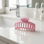 Close-up of pink hair claw clip design