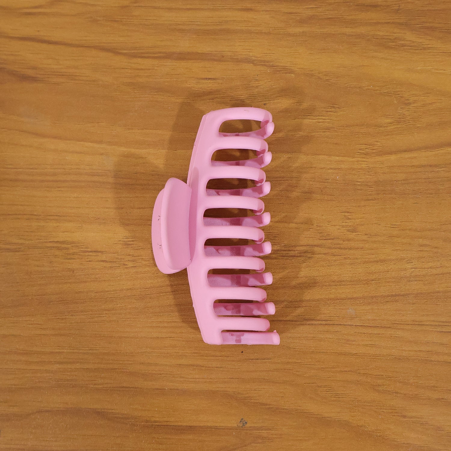 Model wearing elegant pink hair claw clip in styling