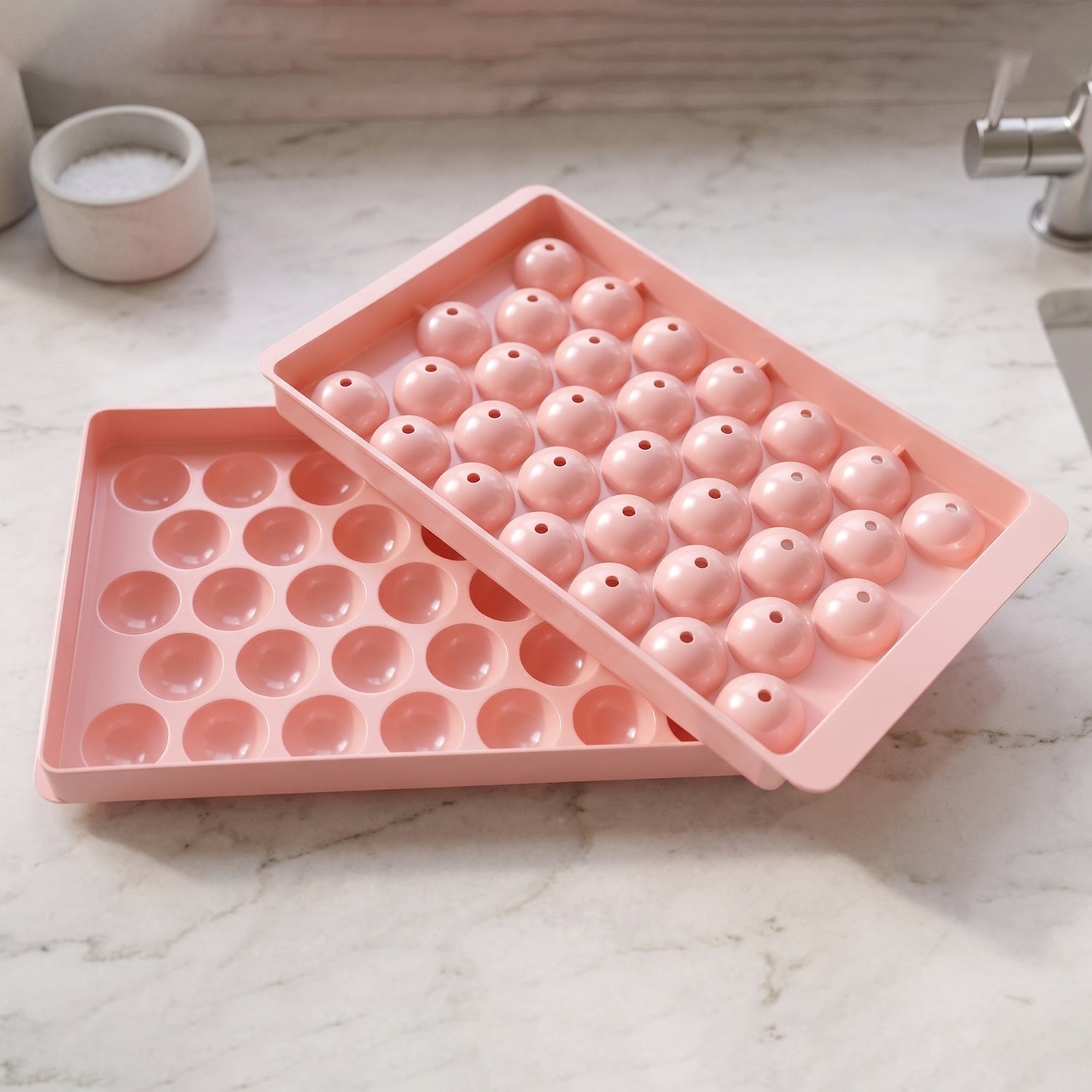 Pink plastic lollipop and ice candy mold for fun home activities