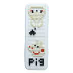 Decorative pen holder with pixel art design on an organized desk