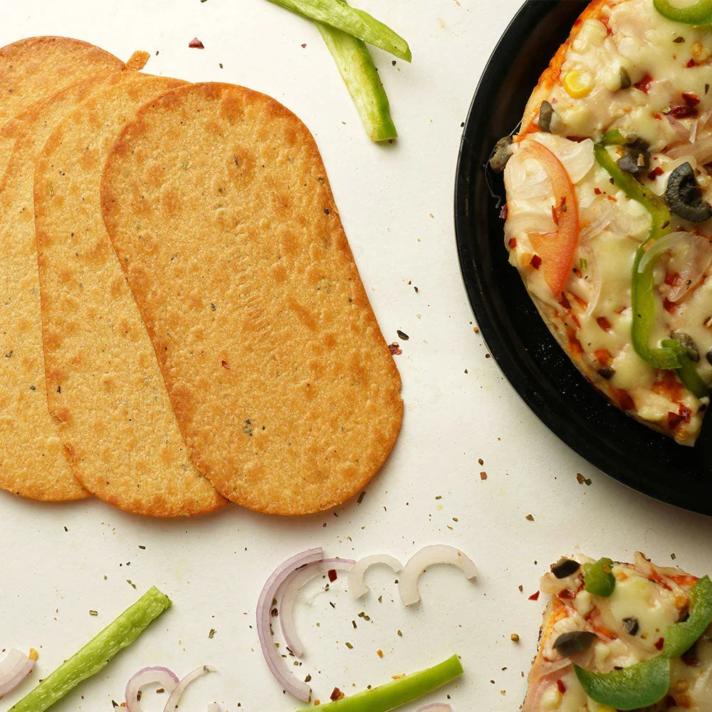 Maniarr's Pizza Mini Slim Bites scattered on a surface, ready for a healthy snack.