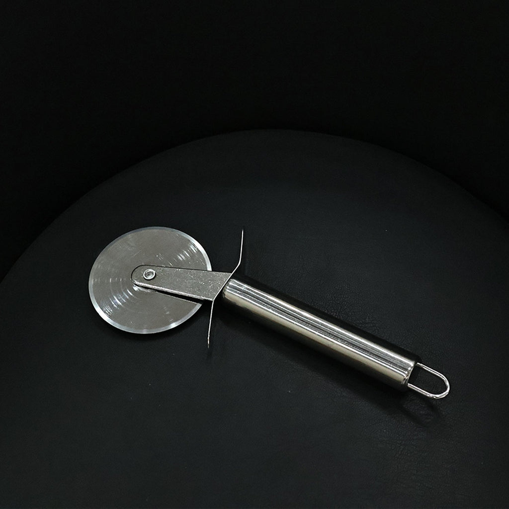 Detail of stainless steel pizza cutter with sharp blade