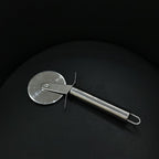 Detail of stainless steel pizza cutter with sharp blade