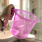 Single plastic bathroom mug displayed on a clean white background.