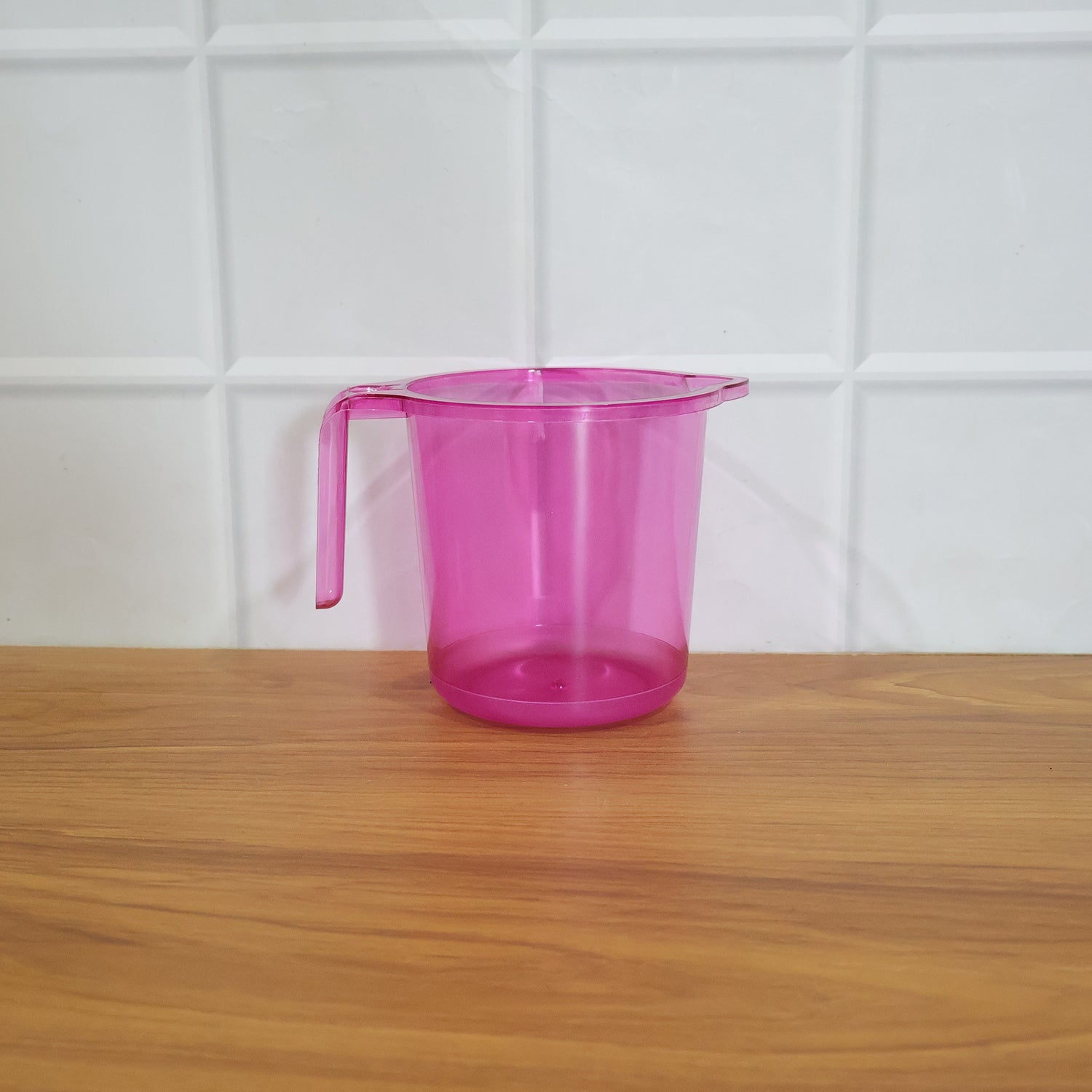 Plastic bathroom mug in a modern bathroom setting.