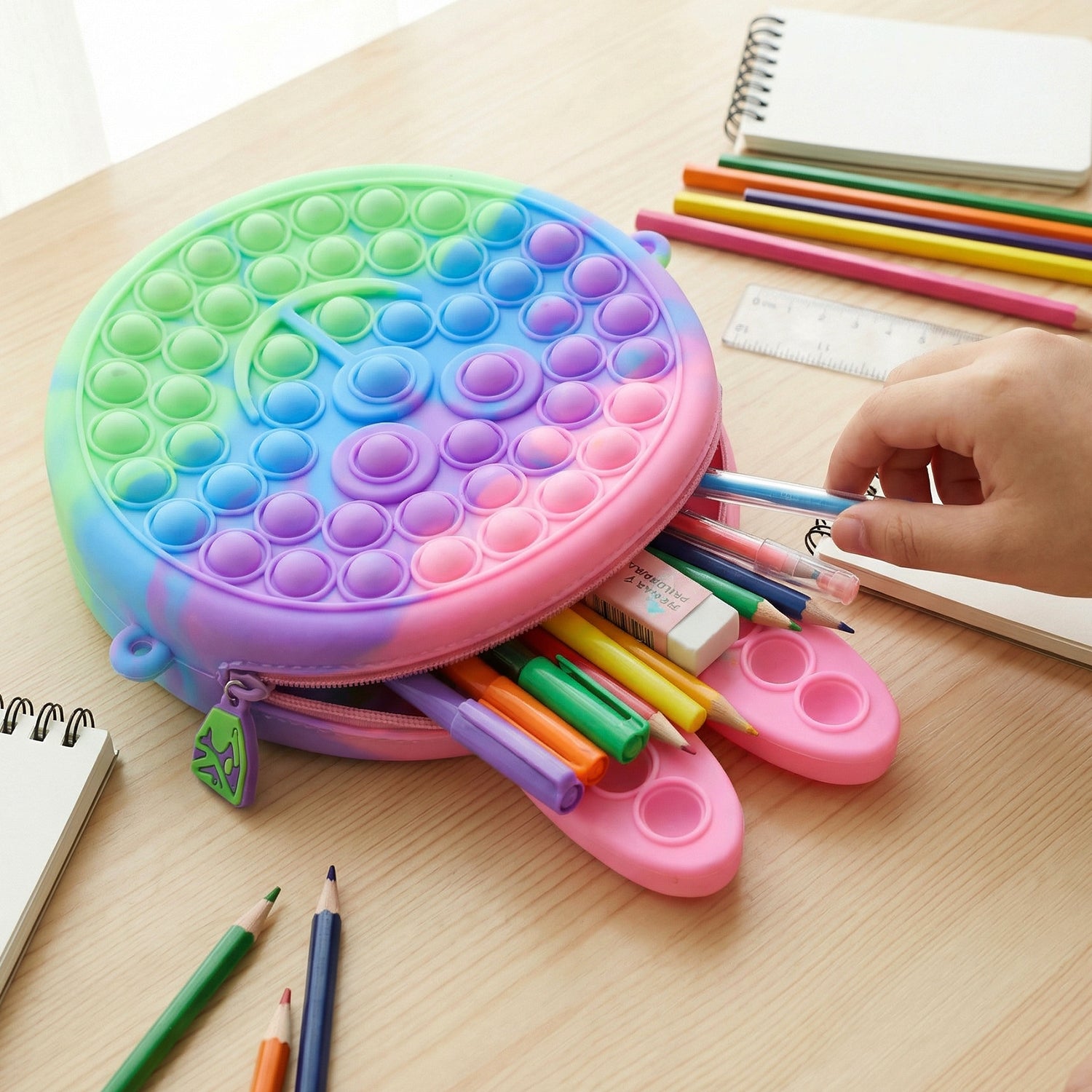 Colorful caterpillar-shaped Pop It pencil pouch with zipper closure